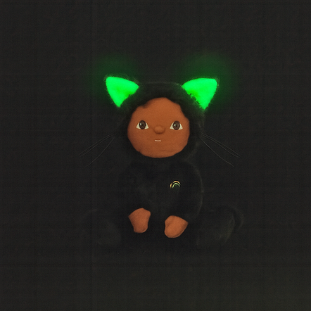 Plush toy with green glowing ears on a black background