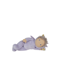 Toy figure of a baby in a purple outfit on a white background