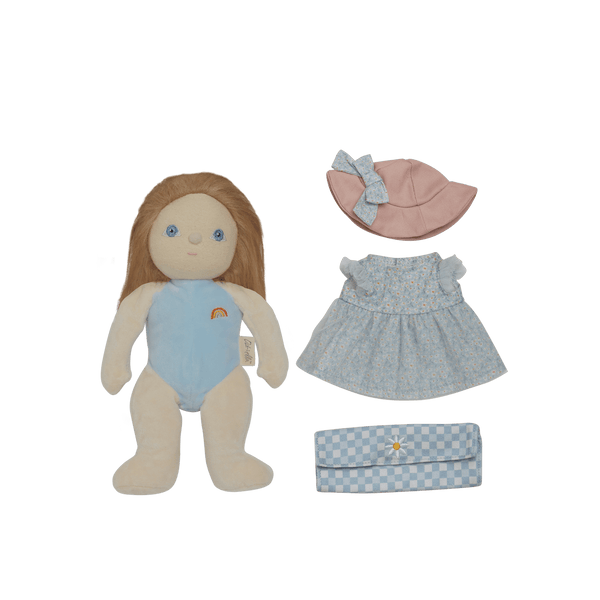 Plush doll with blue outfit, pink hat, and checkered bag on a black background