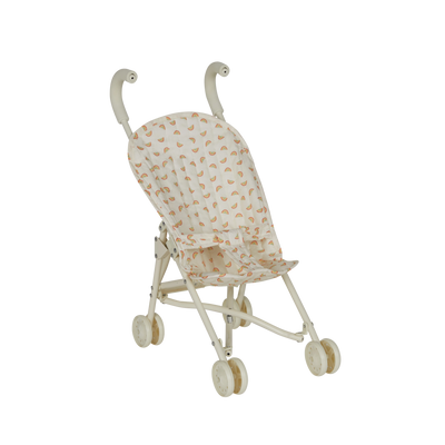 Miniature stroller with rainbow patterns on a white background