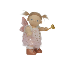 doll wearing white and gold fairy costume
