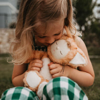 Little girl loves her ginger tabby cat, soft plush toy dinkum doll for kids