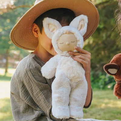 Meet Cozy Dinkum Fenix Fox, a cuddly fox plush toy designed for warmth and coziness. This plush fox has a posable body, sweet embroidered face, tuft of hair, and wears a non-removable suit, making it Ideal for snuggling and imaginative play.