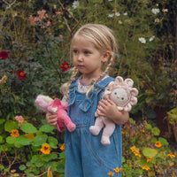 Olli Ella Blossom Buds Dinky Dinkum Rose baby pink flower doll pictured with child and Lily doll