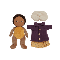 Stuffed doll with a coat and headband on a white background