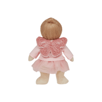 Doll with pink outfit and butterfly wings on a white background