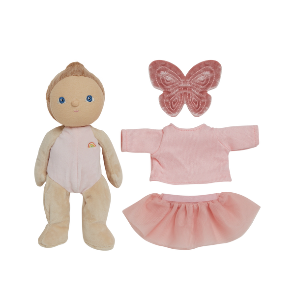 Plush baby doll with pink outfit and butterfly accessory on a white background