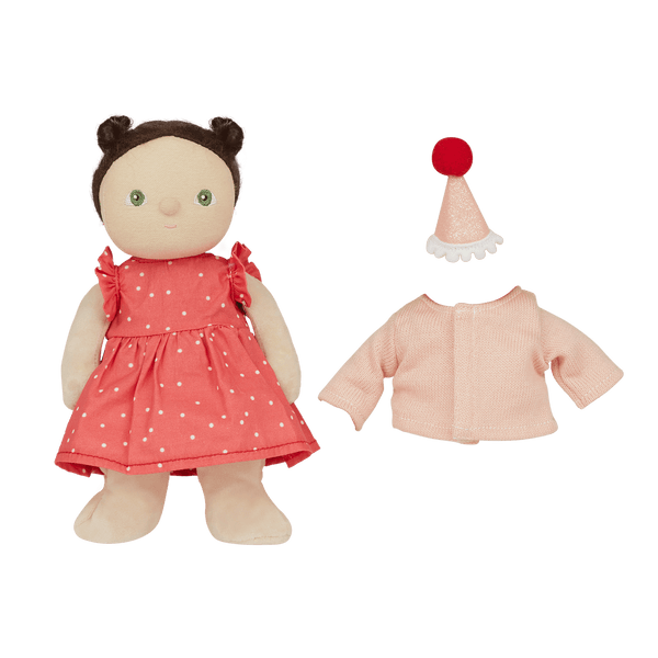 doll in a spot dress with hat and pink cardigan beside it