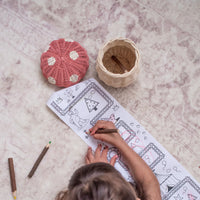 Pink rattan mushroom basket with coloured pencils for kids.