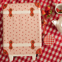 Pink strawberry print suitcase perfectly sized for kids carry on luggage.