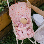 Pink strawberry printed doll stroller for imaginative kids play.